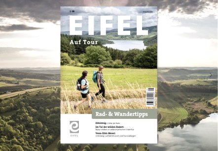 Cover page of ‘Eifel Auf Tour’ Cycling and hiking tips., © Eifel Tourismus GmbH Cover page of ‘Eifel Auf Tour’ Cycling and hiking tips against an idyllic Eifel landscape.