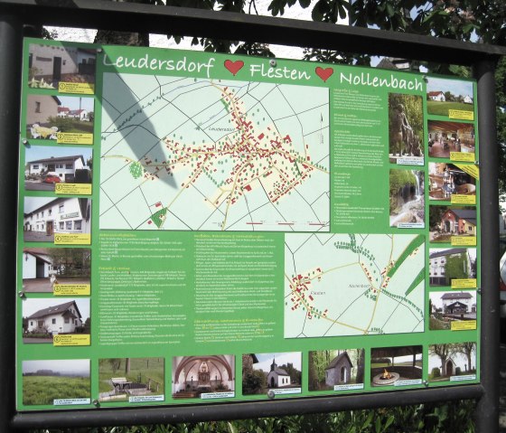 Information board shows map and pictures of Leudersdorf, Flesten and Nollenbach. Includes information on places of interest and accommodation., © Touristik GmbH Gerolsteiner Land, Ute Klinkhammer Information board shows map and pictures of Leudersdorf, Flesten and Nollenbach. Includes information on places of interest and accommodation., © Touristik GmbH Gerolsteiner Land, Ute Klinkhammer