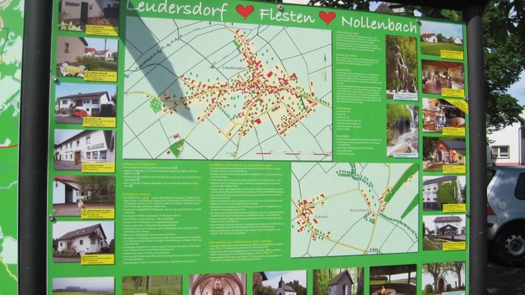 Infotafel mit Karte und Bildern von Leudersdorf, Flesten und Nollenbach.
