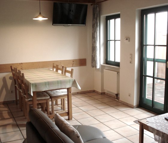 Living/dining area with access to the terrace