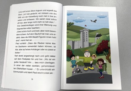 Open pages of a children's book with text on one page and an illustration on the other.