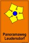 Schild mit gelbem Blütenmotiv und Text 'Panoramaweg Leudersdorf' auf orangefarbenem Hintergrund., © Touristik GmbH Gerolsteiner Land